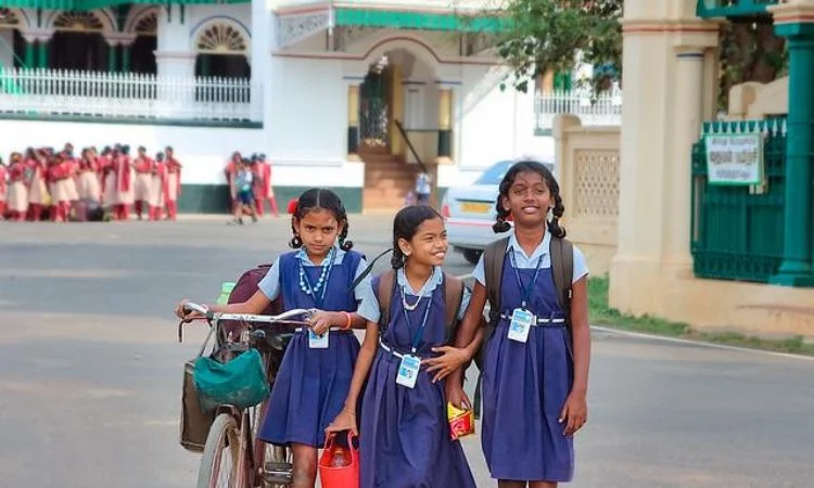Three school girl going to school in his village